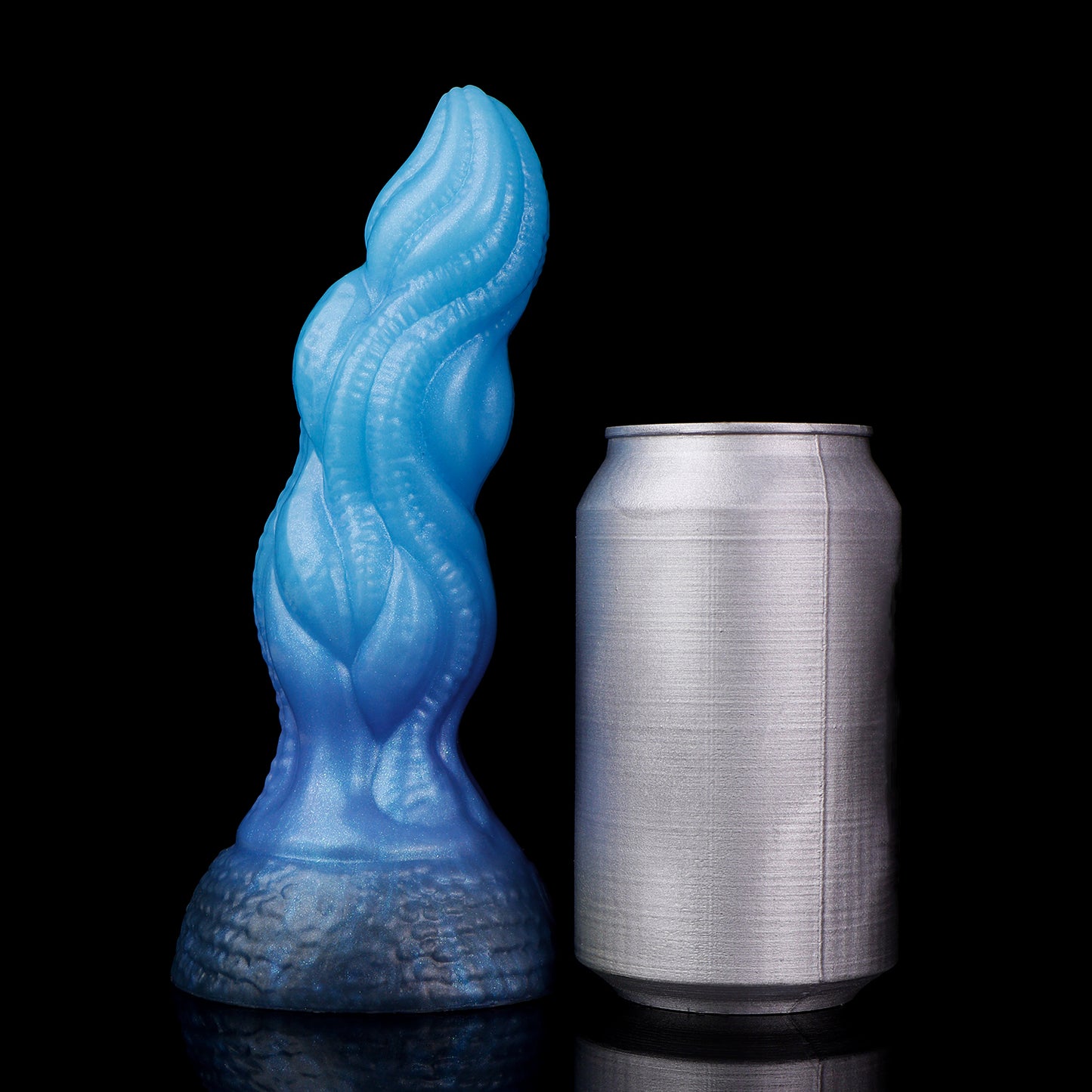 Lumen the Bloomborn dildo, Arctic colorway, standing upright beside a soda can for size comparison