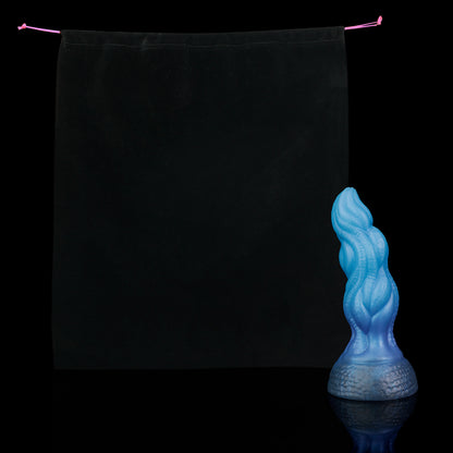 Lumen the Bloomborn dildo, Arctic colorway, shown alongside the included black Lunara's Realm storage pouch