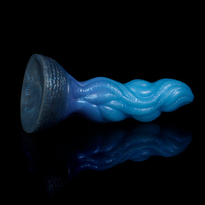 Lumen the Bloomborn dildo, Arctic colorway, tilted to show the broad darkened suction-cup base