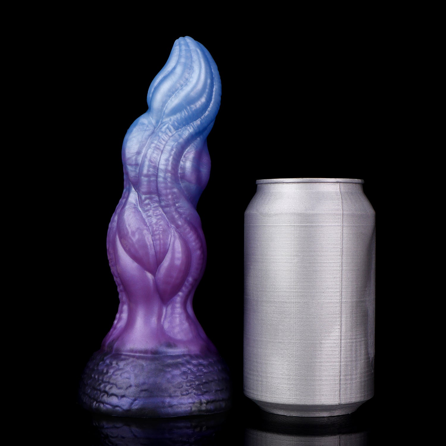 Lumen the Bloomborn dildo, Spectre colorway, standing upright beside a soda can for size comparison