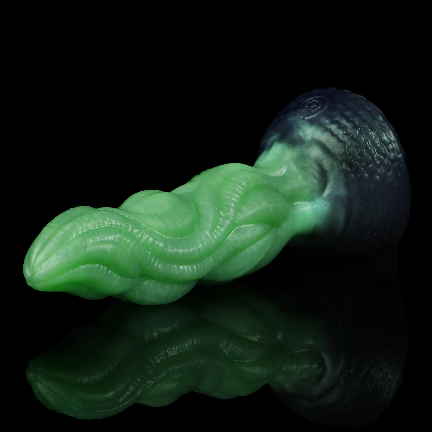 Lumen the Bloomborn dildo, Venom colorway, lying on its side in full profile showing the tentacle-like shaft