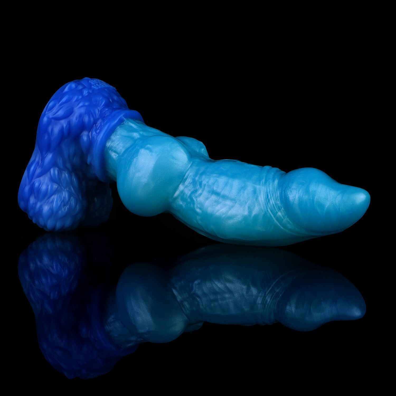 Lycan the Werewolf dildo, Shock colorway, lying on its side in full profile showing the gleaming blue shaft and cobalt fur base
