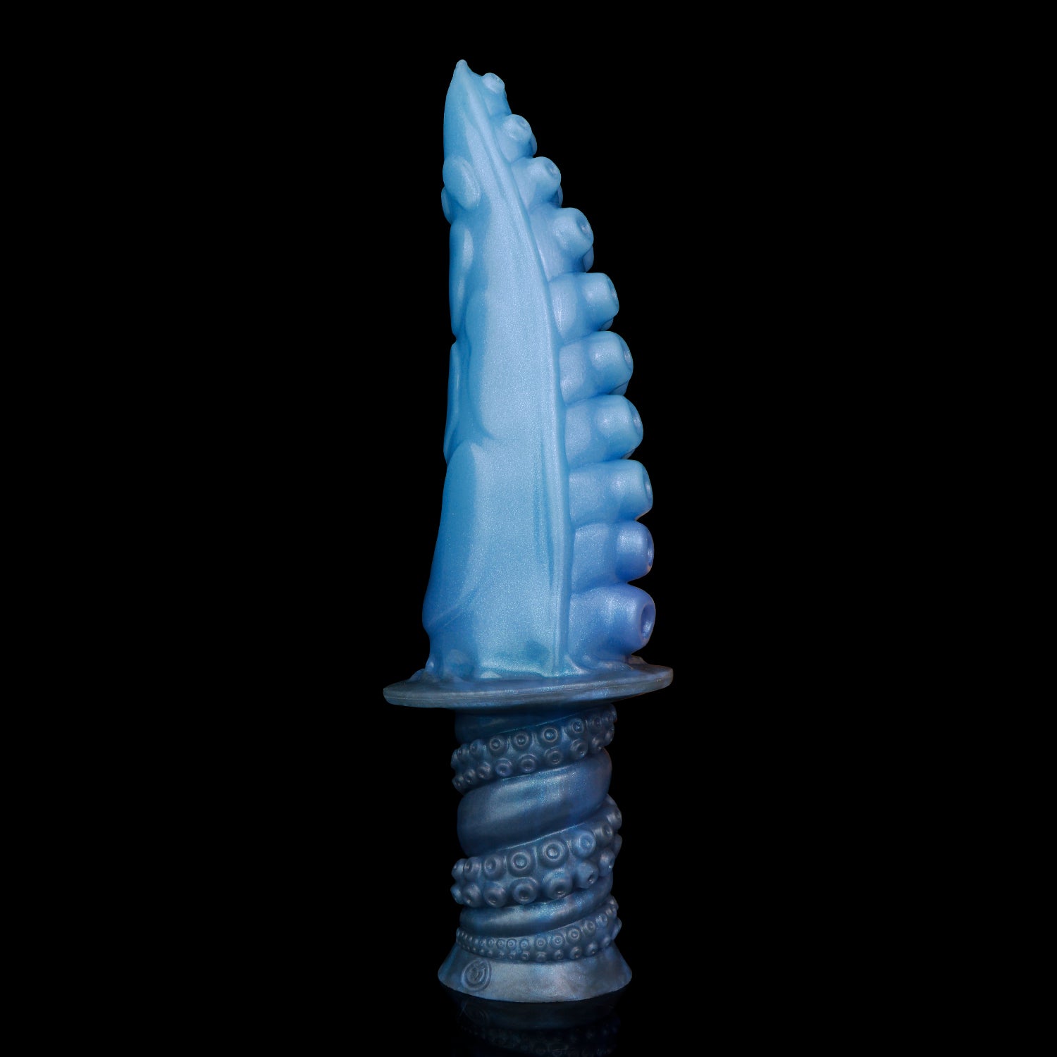 Moros the Deep One dildo, Arctic colorway, standing upright showing the ribbed side of the coiled shaft
