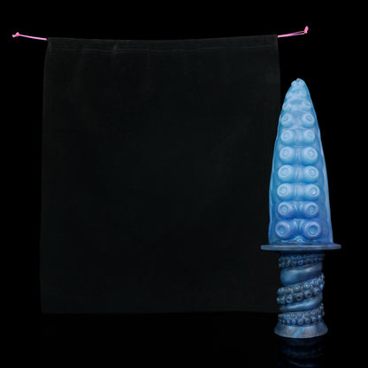 Moros the Deep One dildo, Arctic colorway, shown alongside the included black Lunara's Realm storage pouch