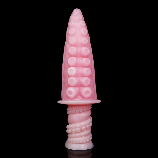 Moros the Deep One dildo, Fairy Floss colorway, standing upright on its ergonomic handle showing the sucker-textured tapered tip