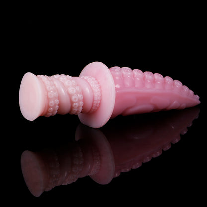 Moros the Deep One dildo, Fairy Floss colorway, angled view with the ergonomic ribbed handle in the foreground