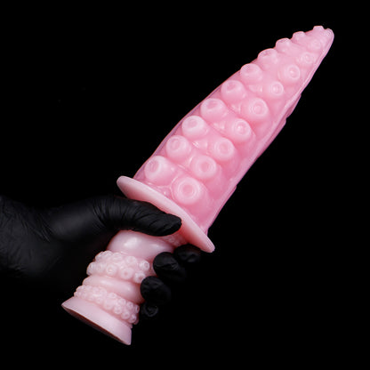 Moros the Deep One dildo, Fairy Floss colorway, held by the ergonomic handle in a gloved hand