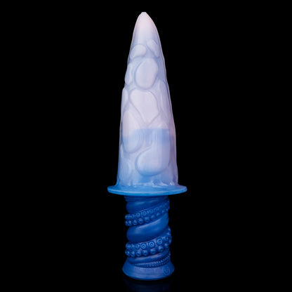 Moros the Deep One dildo, Flux colorway, standing upright showing the deep indigo-blue base fading into a soft, luminous pale pink tip