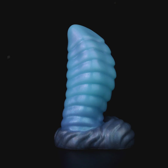 Kael the Dragonkin dildo, Arctic colorway, product video showing the piece standing on its scale-textured base