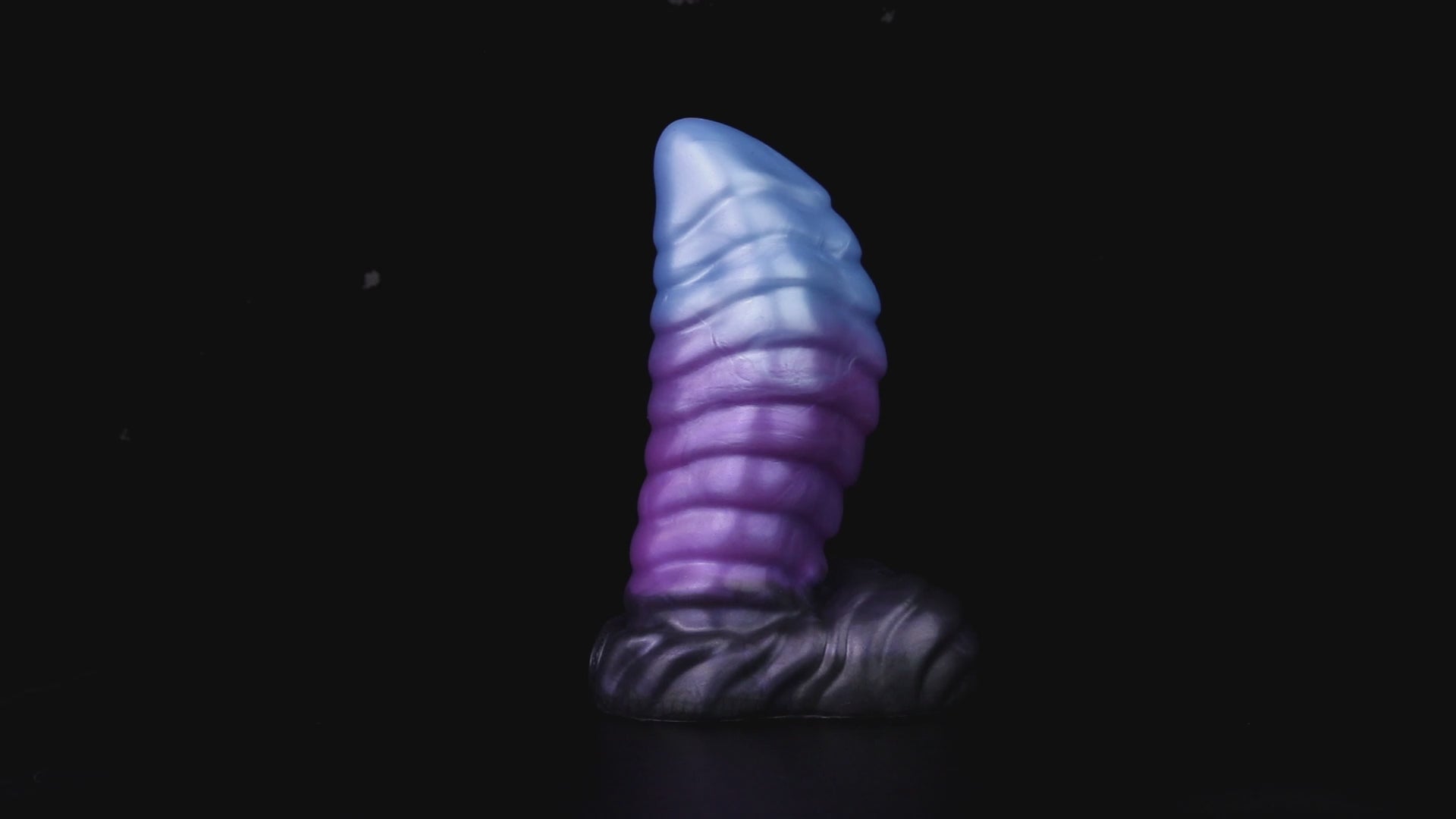 Kael the Dragonkin dildo, Spectre colorway, product video showing the piece standing on its scale-textured base