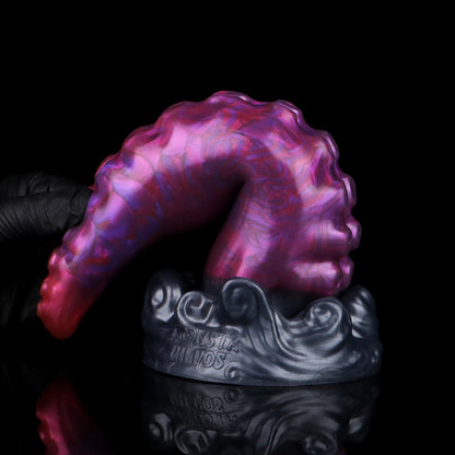 Tendrul the Tentacle dildo, Adrenaline colorway, standing on its base with the tentacle curled over to show its flexibility