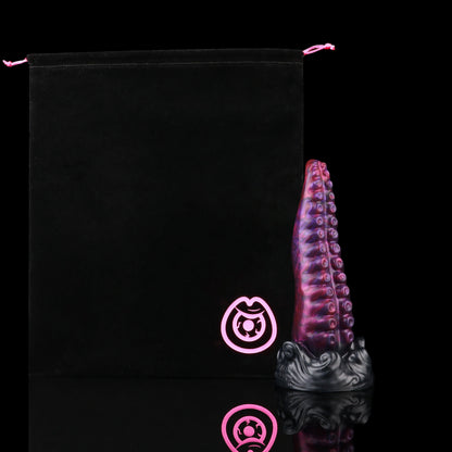 Tendrul the Tentacle dildo, Adrenaline colorway, shown alongside the included black Lunara's Realm storage pouch