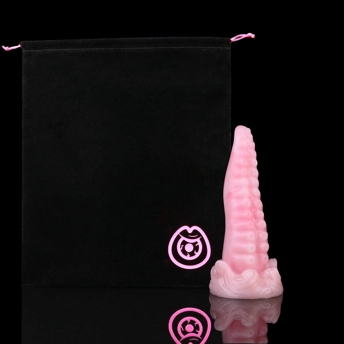Tendrul the Tentacle dildo, Fairy Floss colorway, shown alongside the included black Lunara's Realm storage pouch