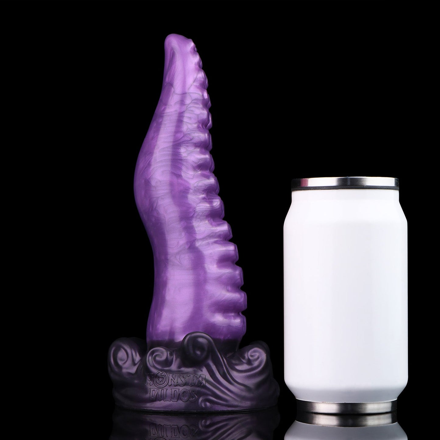 Tendrul the Tentacle dildo, Grape colorway, standing upright beside a soda can for size comparison