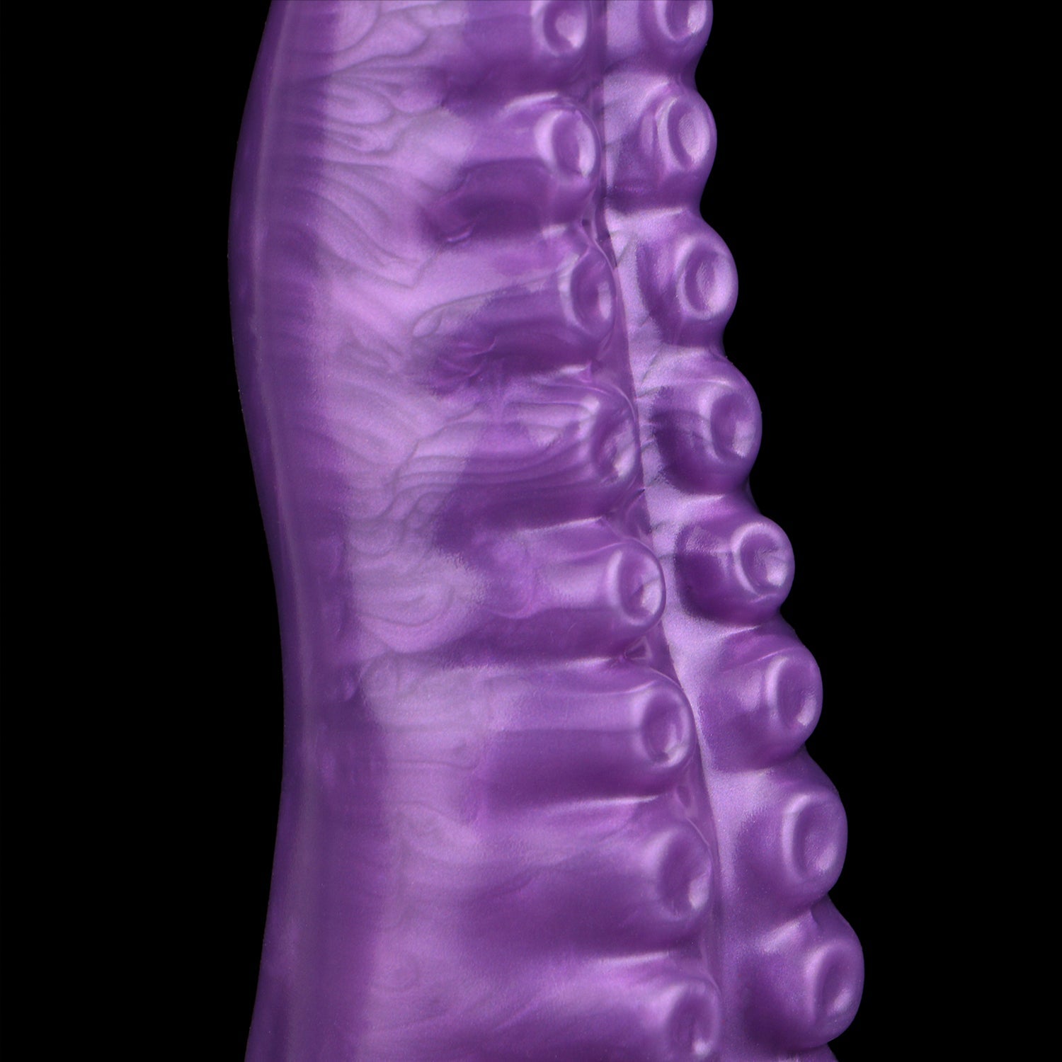 Tendrul the Tentacle dildo, Grape colorway, close-up of the sucker detail along the tentacle