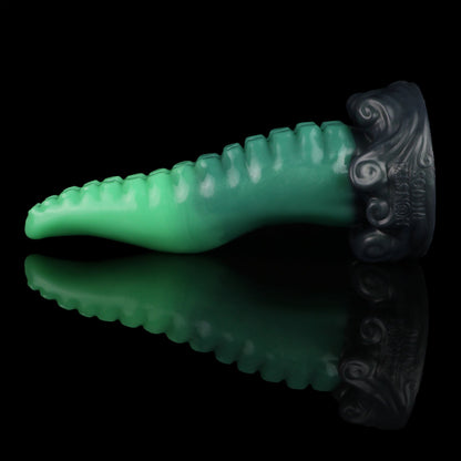 Tendrul the Tentacle dildo, Ogre colorway, lying on its side with the whirlpool-wave base to the right