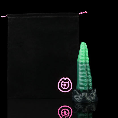 Tendrul the Tentacle dildo, Ogre colorway, shown alongside the included black Lunara's Realm storage pouch