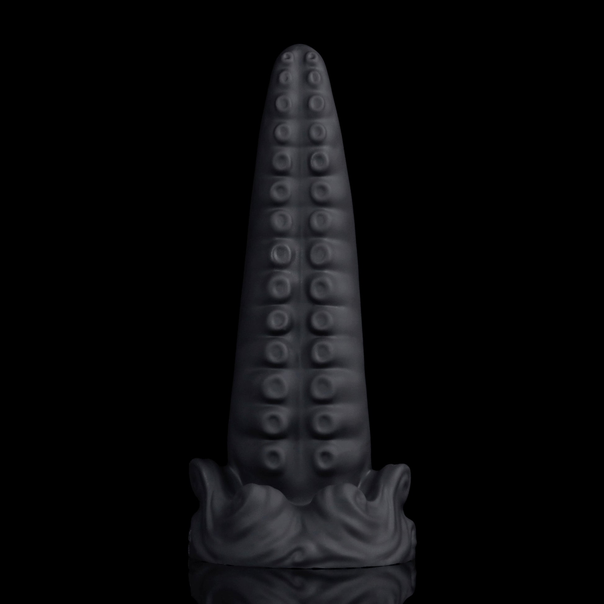 Tendrul the Tentacle dildo, Shadow colorway, standing upright on its whirlpool-wave suction base with the suckers facing forward