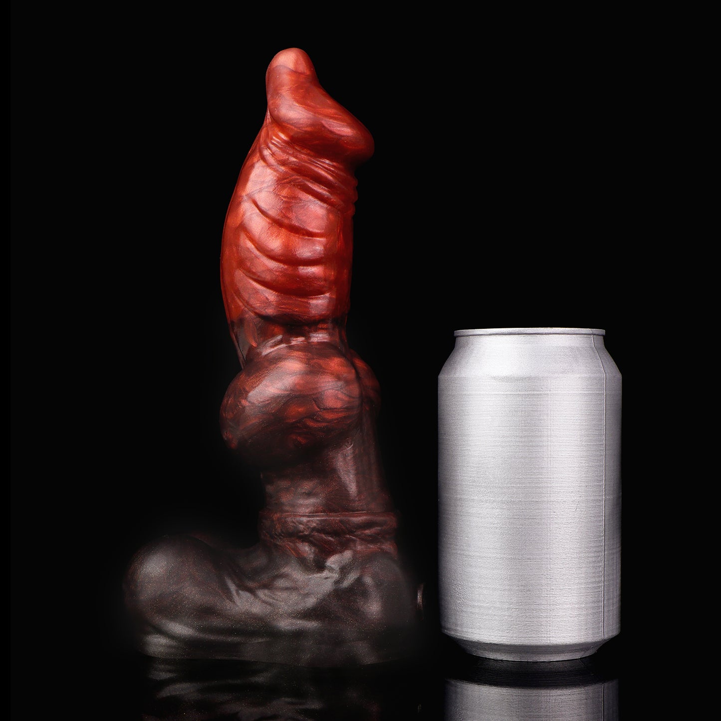 Vulpes the Nightfox dildo, Lava colorway, standing upright beside a soda can for size comparison
